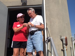 The Town Of Caswell Beach gave Bob a special commemorative pin to recognize his achievement - presented by Kathleen Morrison one of the Lighthouse's long time guides 